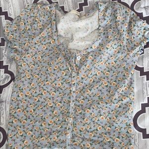 Floral top orange tiny flowers and blue background